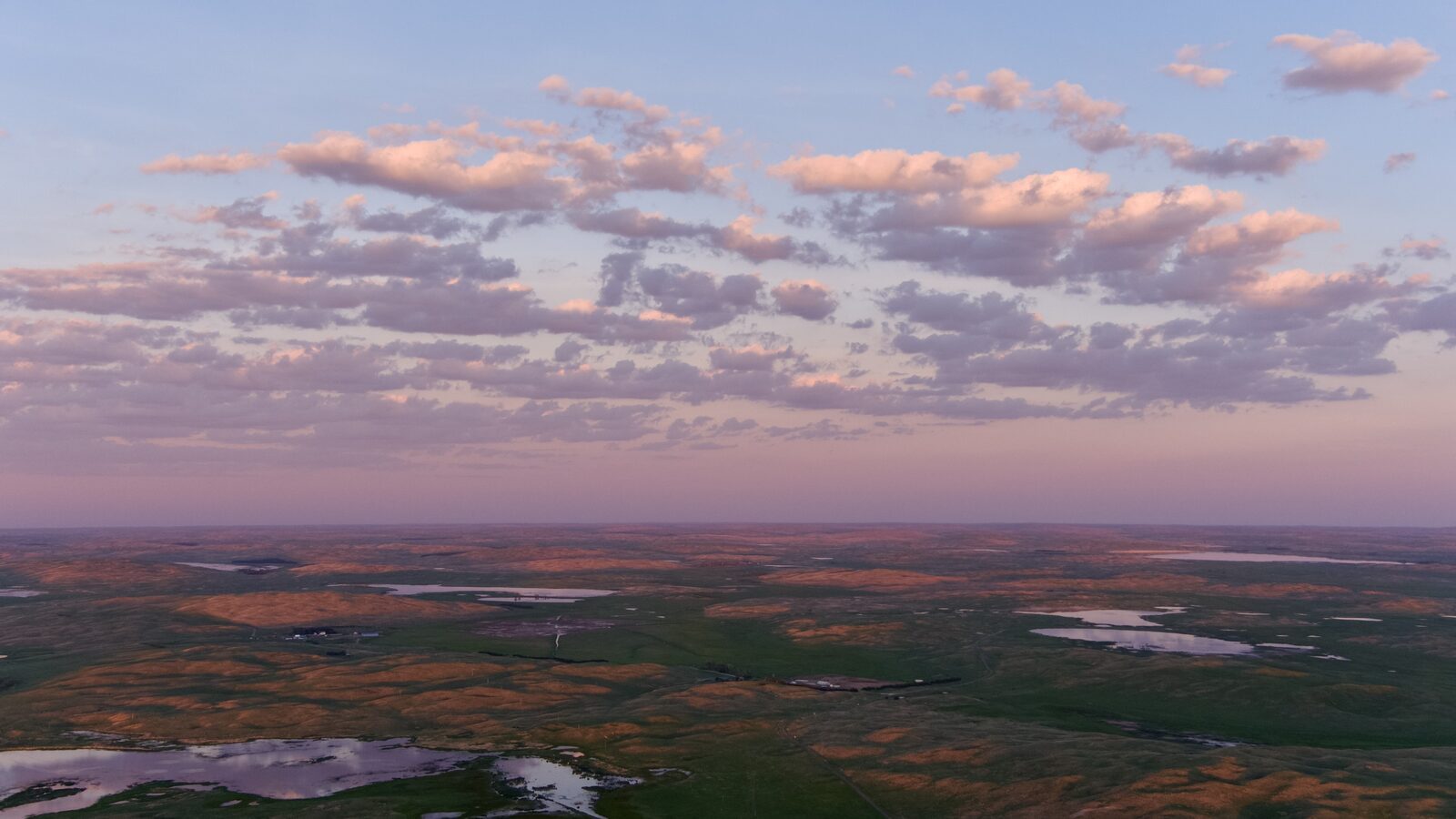 Drone view looking north over Lake Alkali at sunset