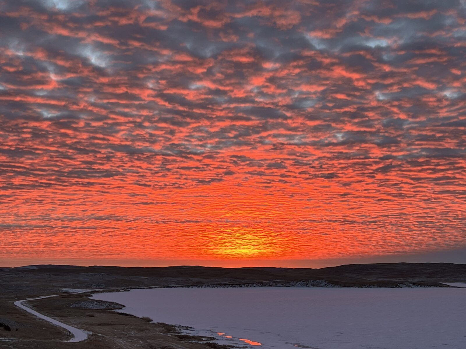Winter sunrise over frozen Lake Alkali